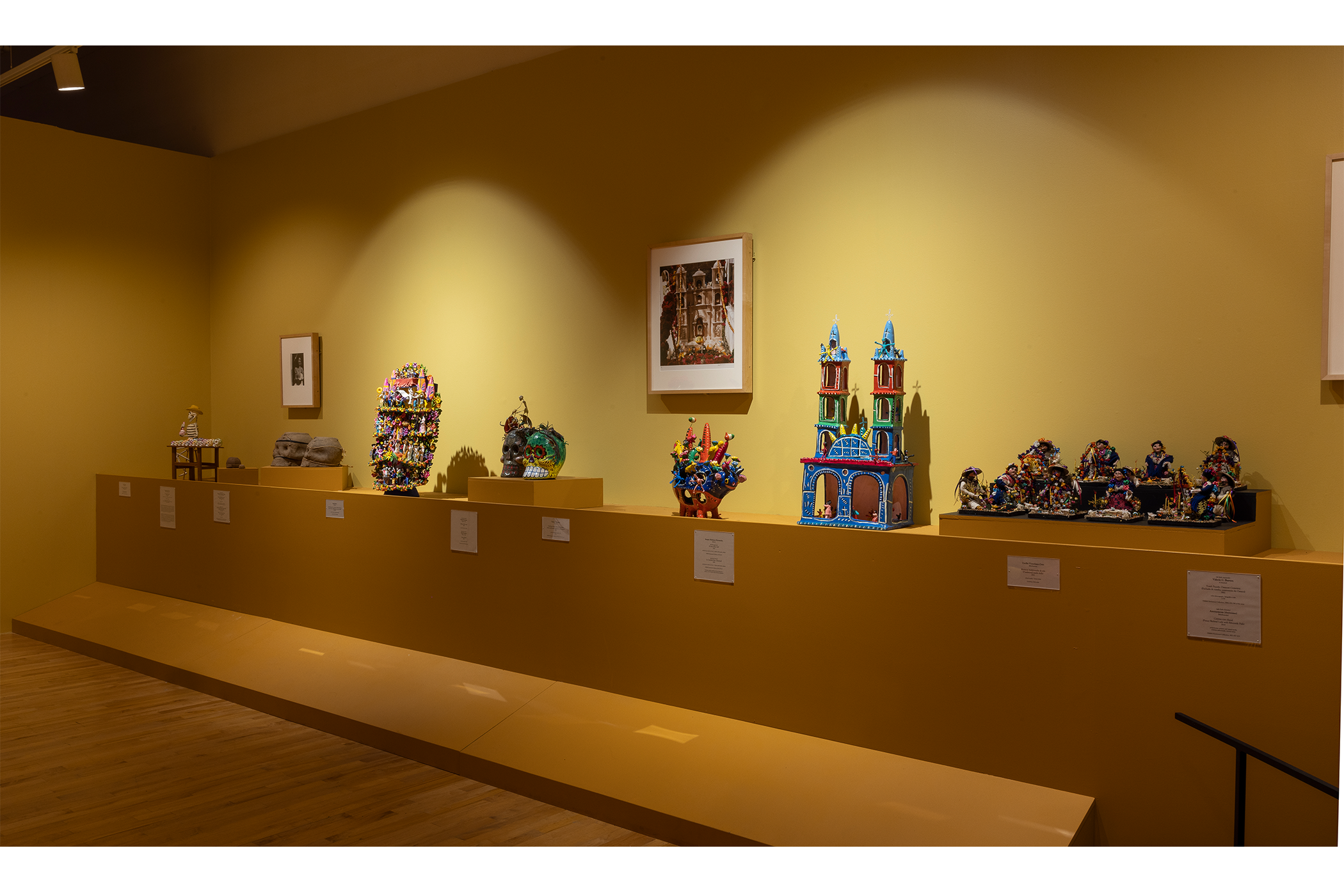 A Detail shot of the artworks on display in the yellow and pink room exhibit.