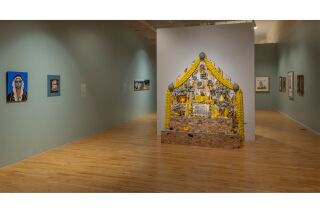 An overview shot of the artwork on display in the teal room.