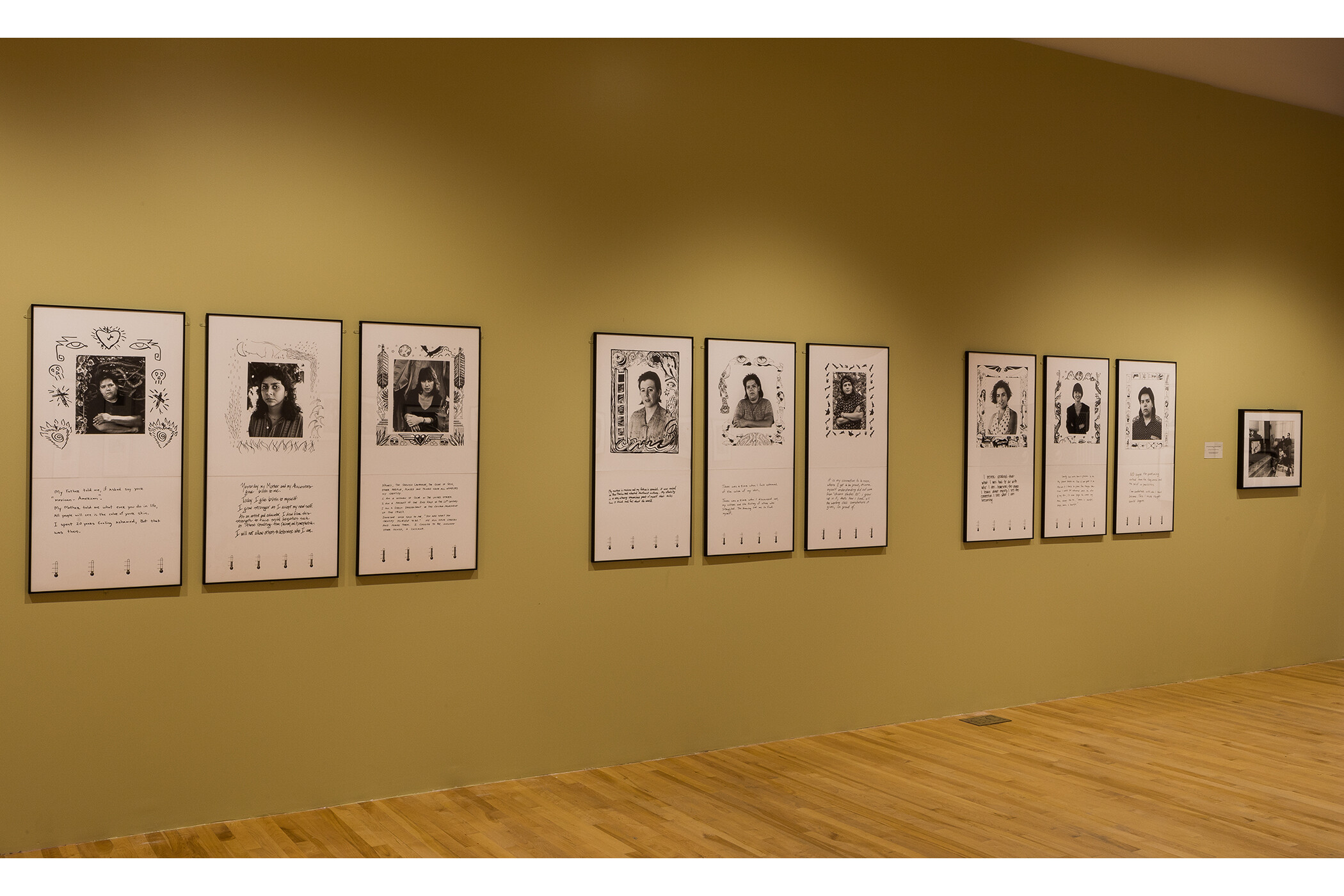 Photo of gallery wall with ten pieces of art hanging