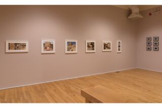 Photo of two gallery walls with six color photographs and six black and white photographs