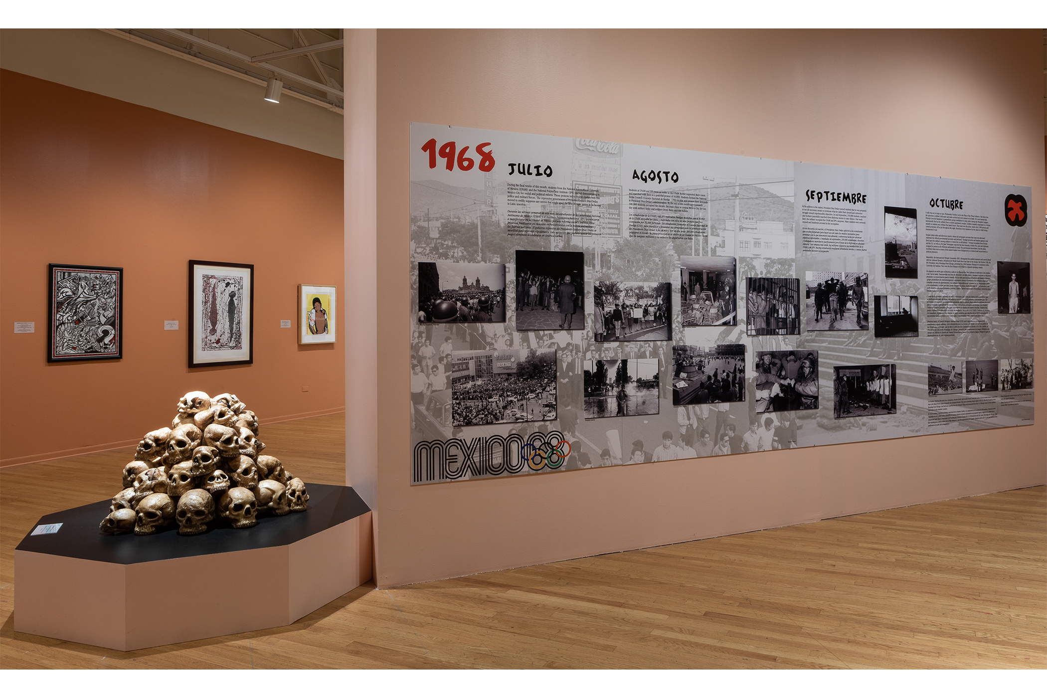 A pile of skulls sculpture to the left of an infographic explaining the timeline of the Tlatelolco Massacre.