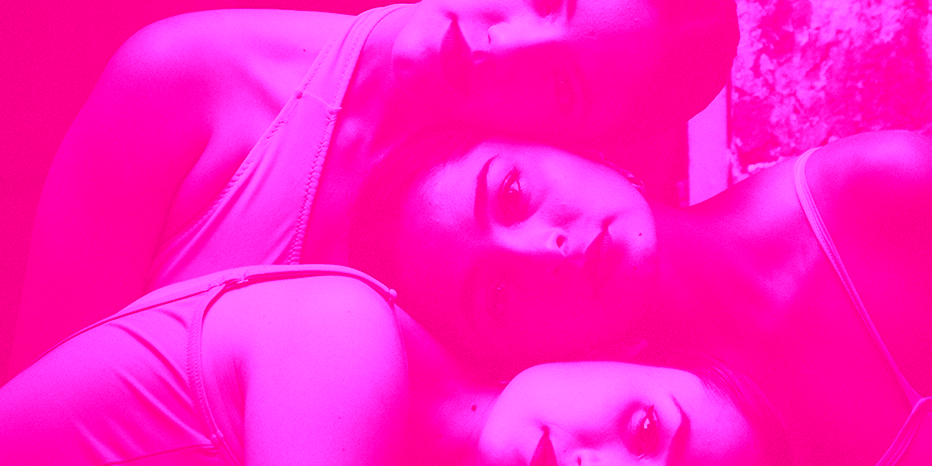A hot pink image of three sisters embracing