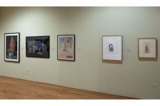 Image of gallery wall with five pieces of art