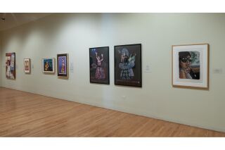 Image of gallery wall with seven pieces of art