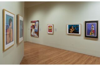 Image of two gallery walls. Left wall is at an angle and shows two pieces of art, right wall shows four pieces of art
