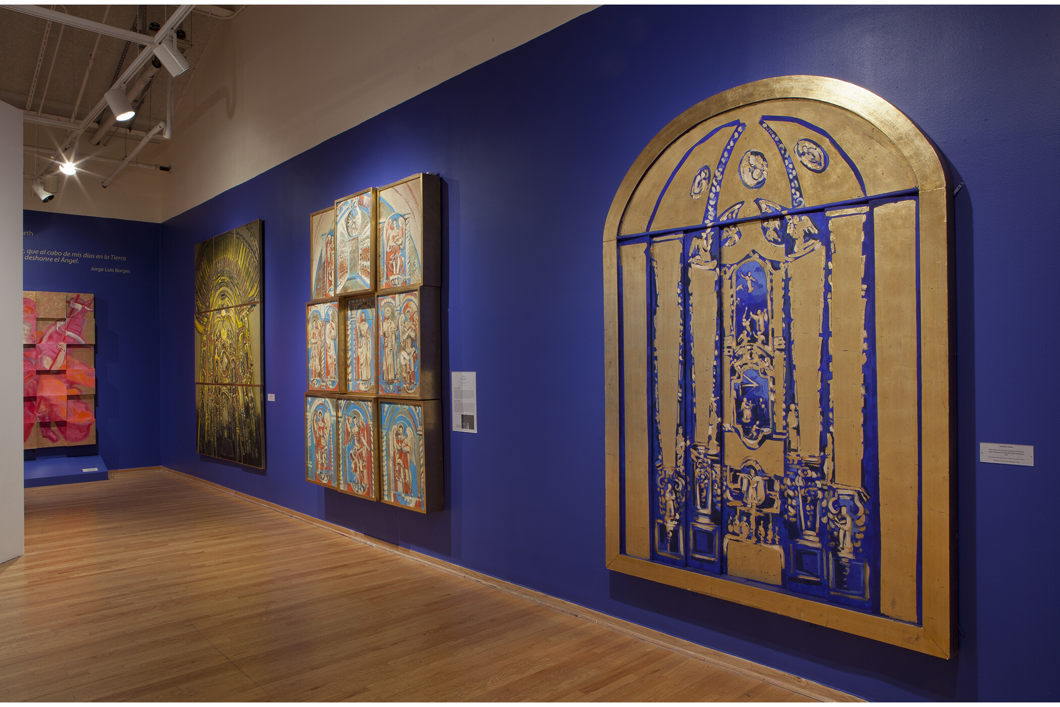 four art pieces hang on the gallery walls.