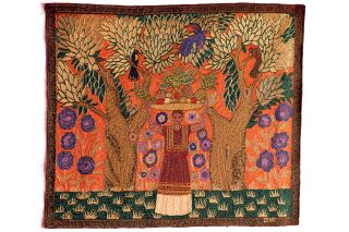 Close up image of textile. Woman holding basket of fruits over her head in the middle of forest