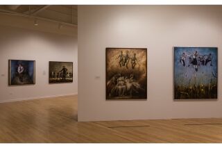 Image of two gallery walls with four hanging paintings total