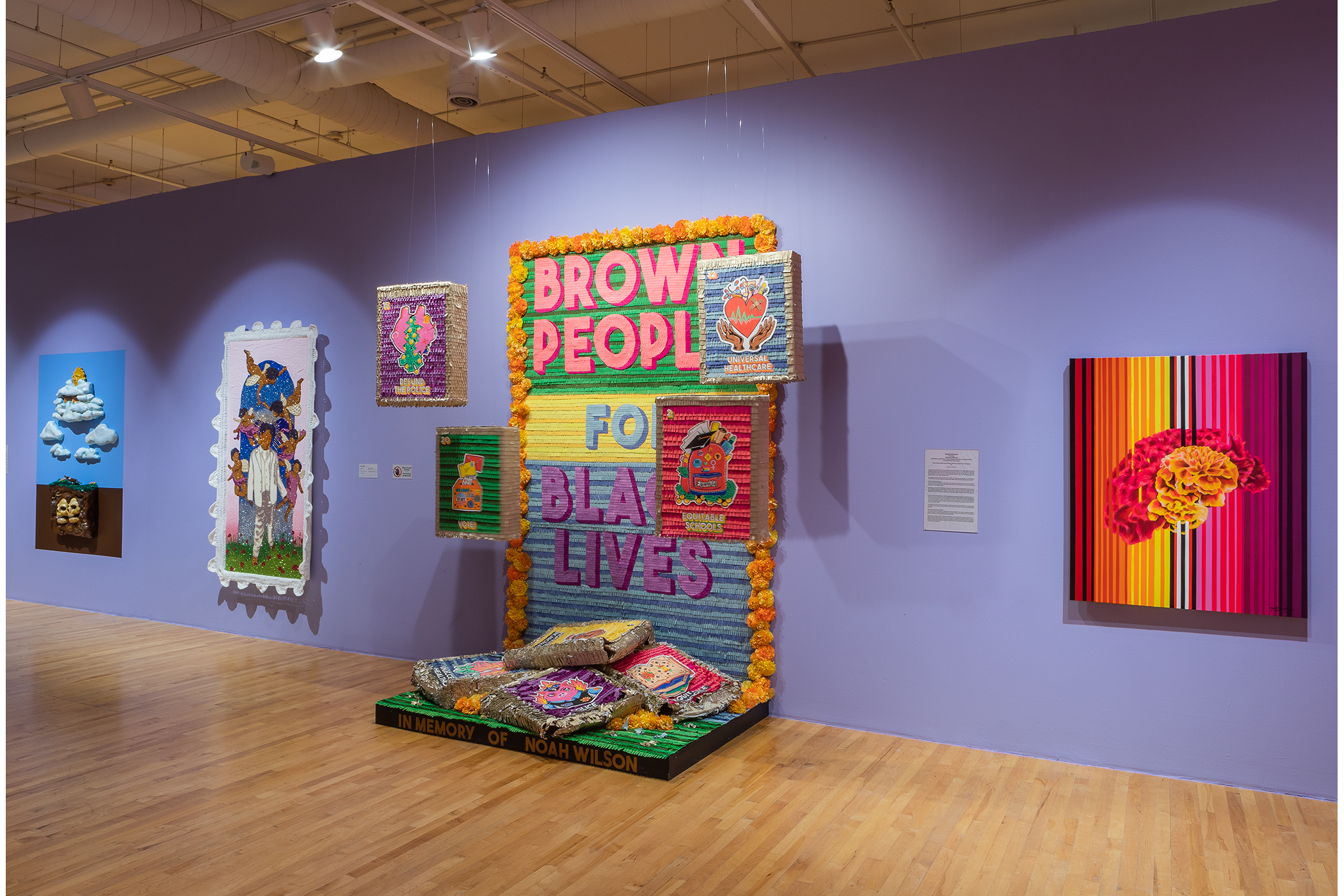 Various installations of art against the wall.