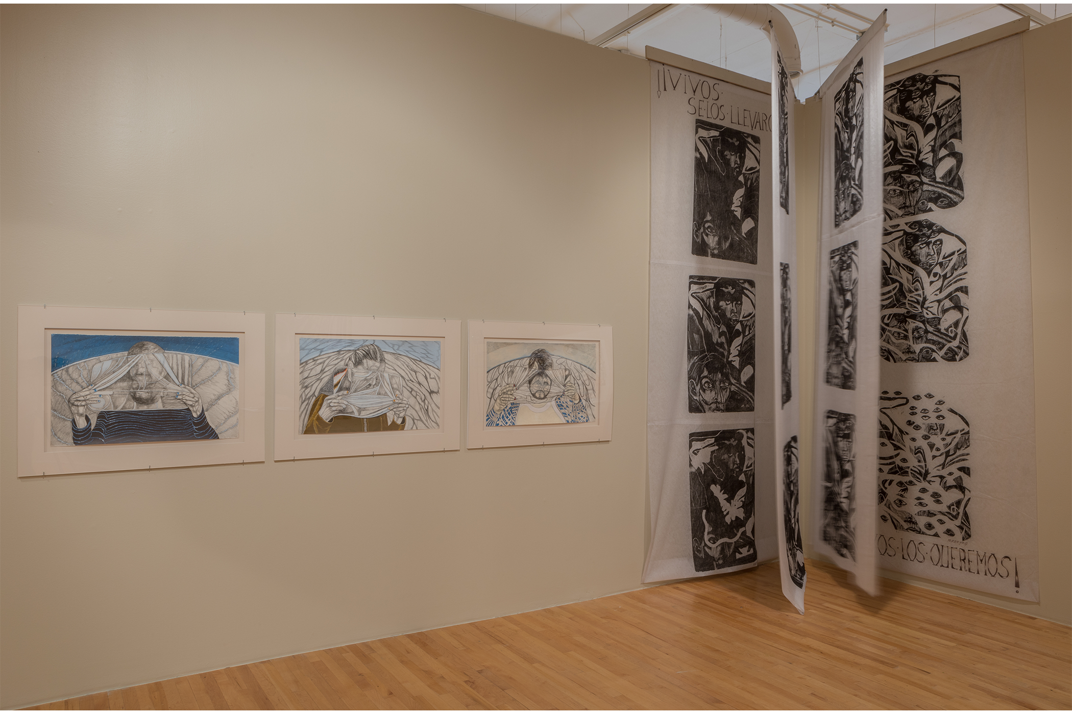 Two installations: a collection of mixed media on paper and a corner installation of prints on 4 large hanging pellon sheets.