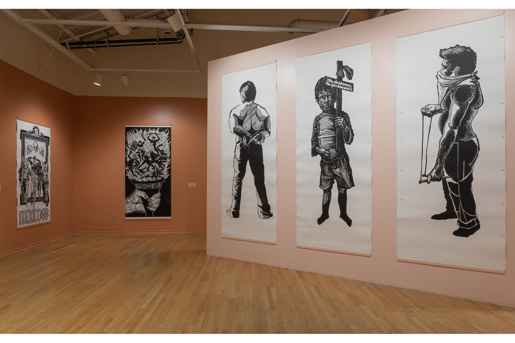 An overview shot of the exhibition in a beige gallery room.