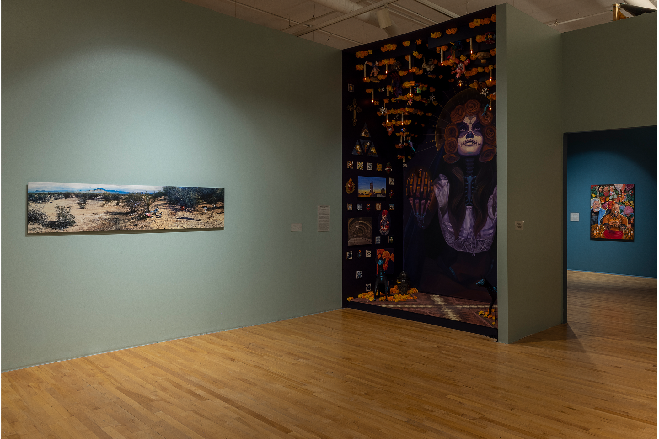 An overview shot of the artwork on display in the teal room.