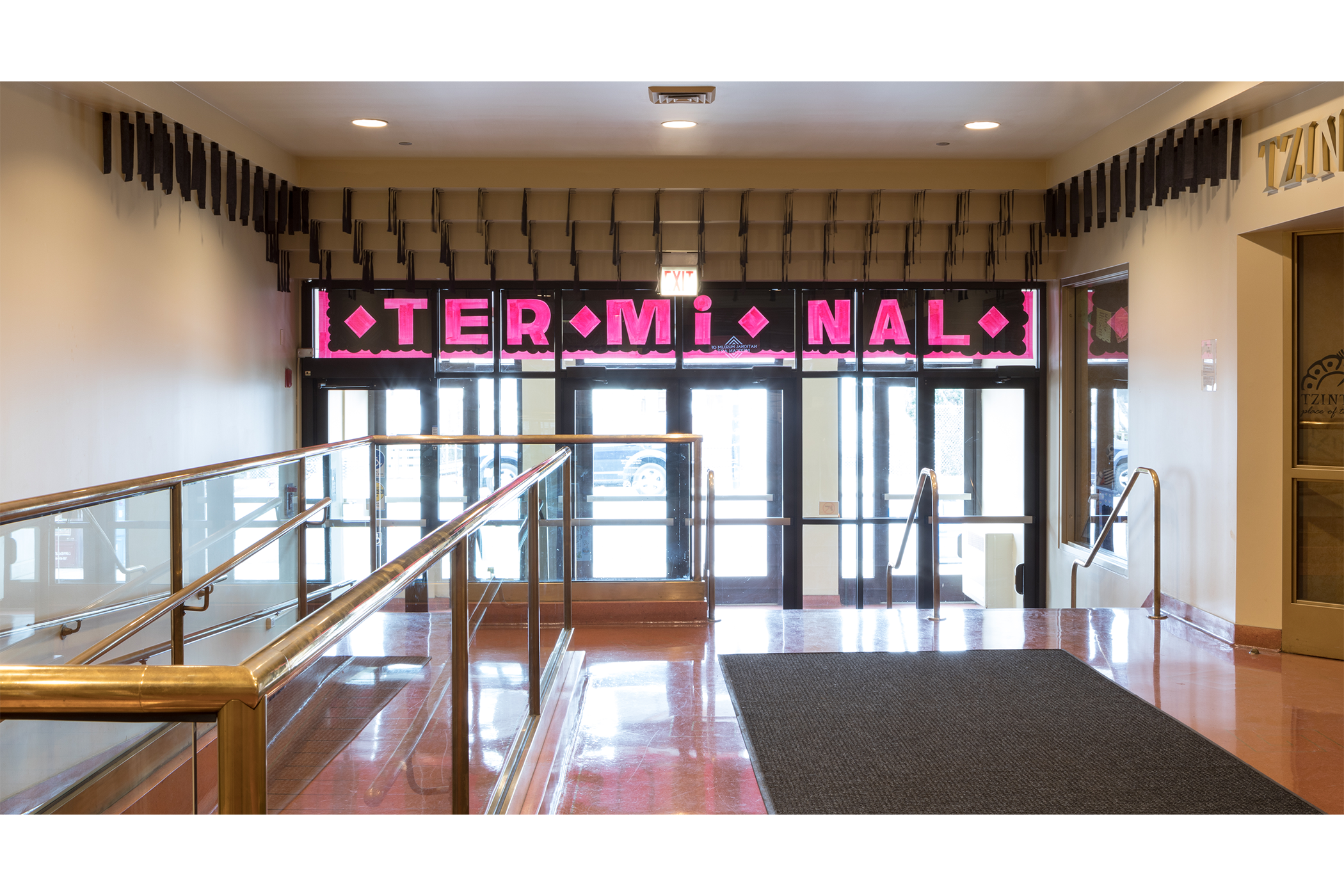 shot of the museum exit, showcasing the installation above the exit.