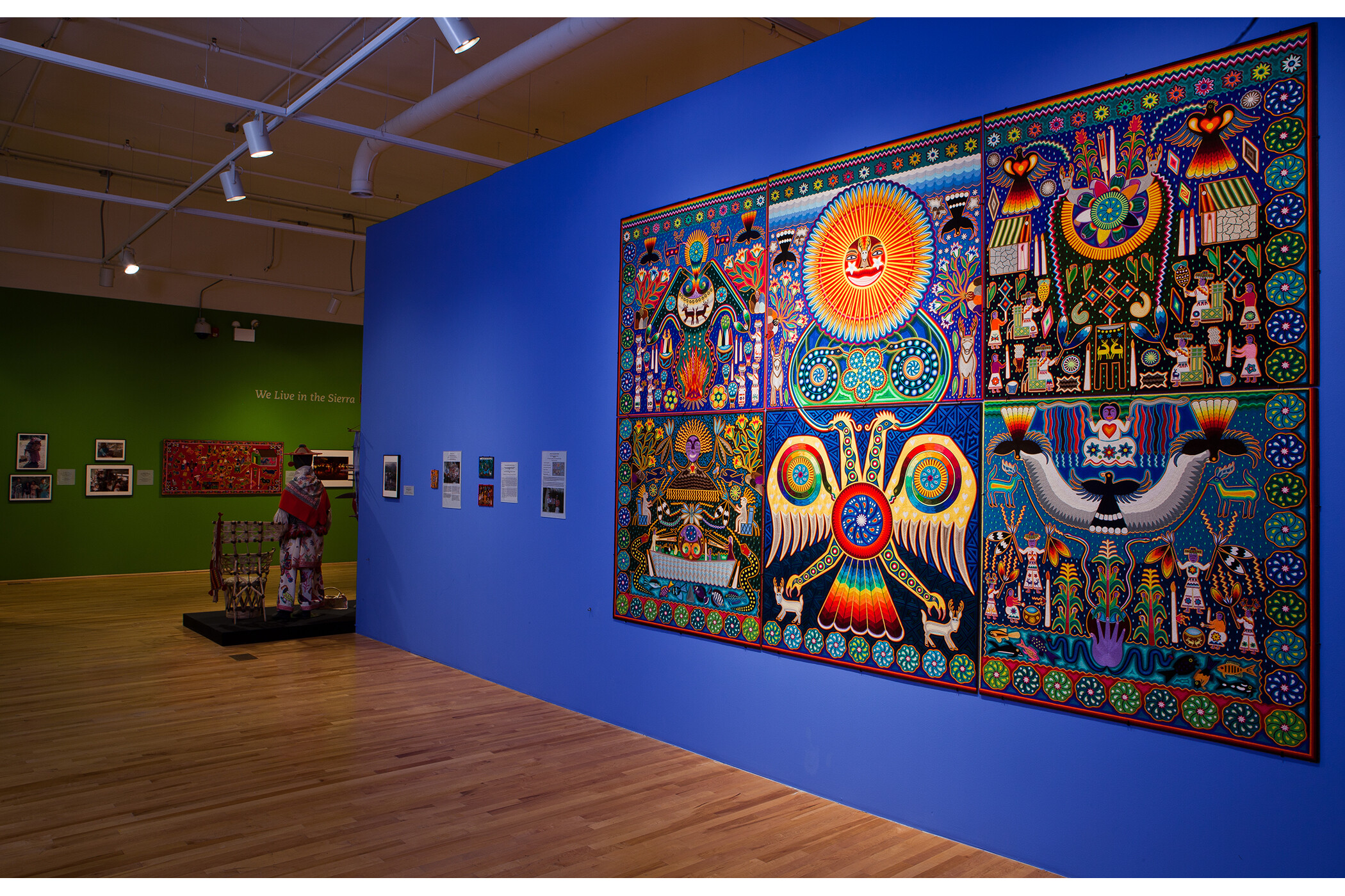 Photo of multiple gallery walls, including giant mural used for cover and listing photo