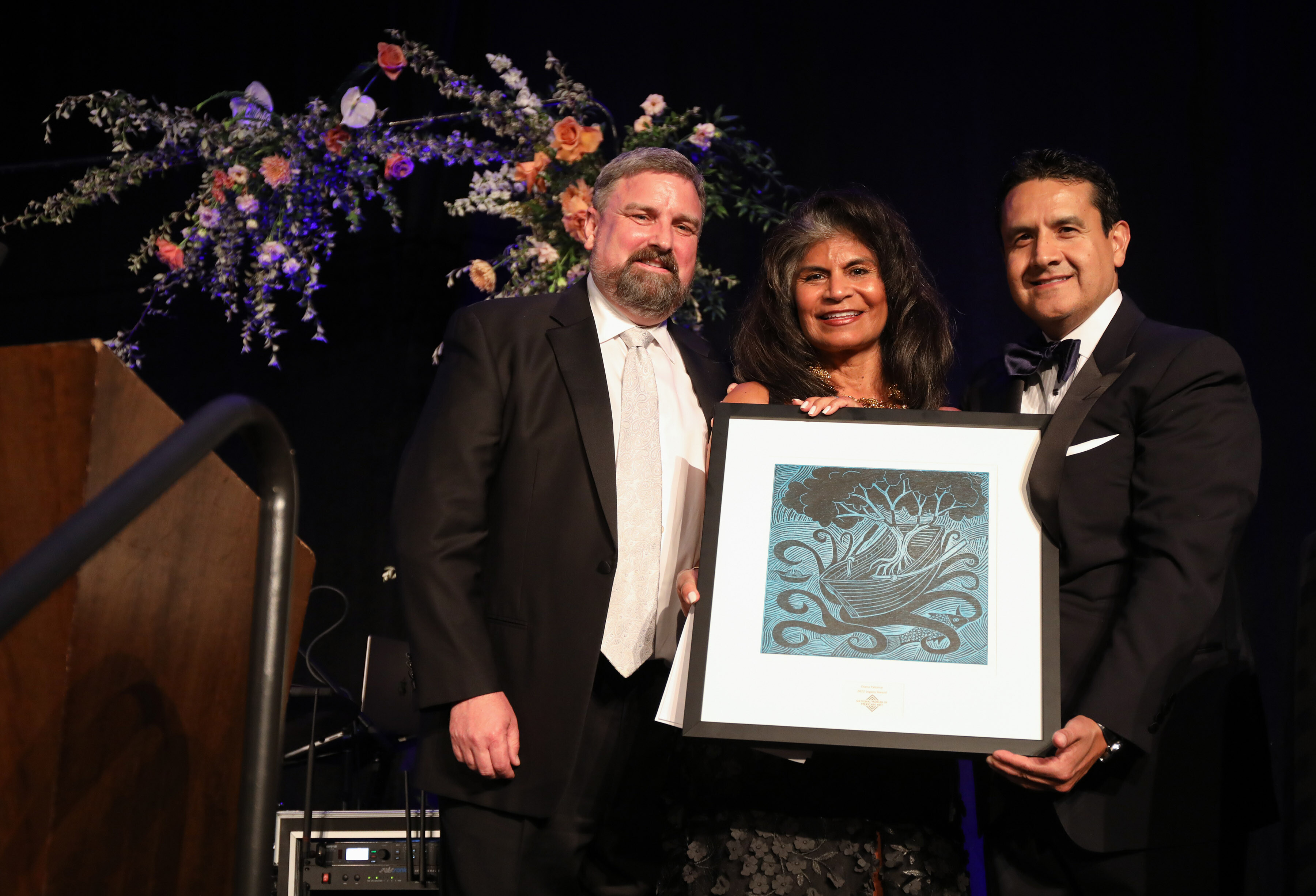 Diana Palomar receiving Legacy Ward from Carlos Cardenas