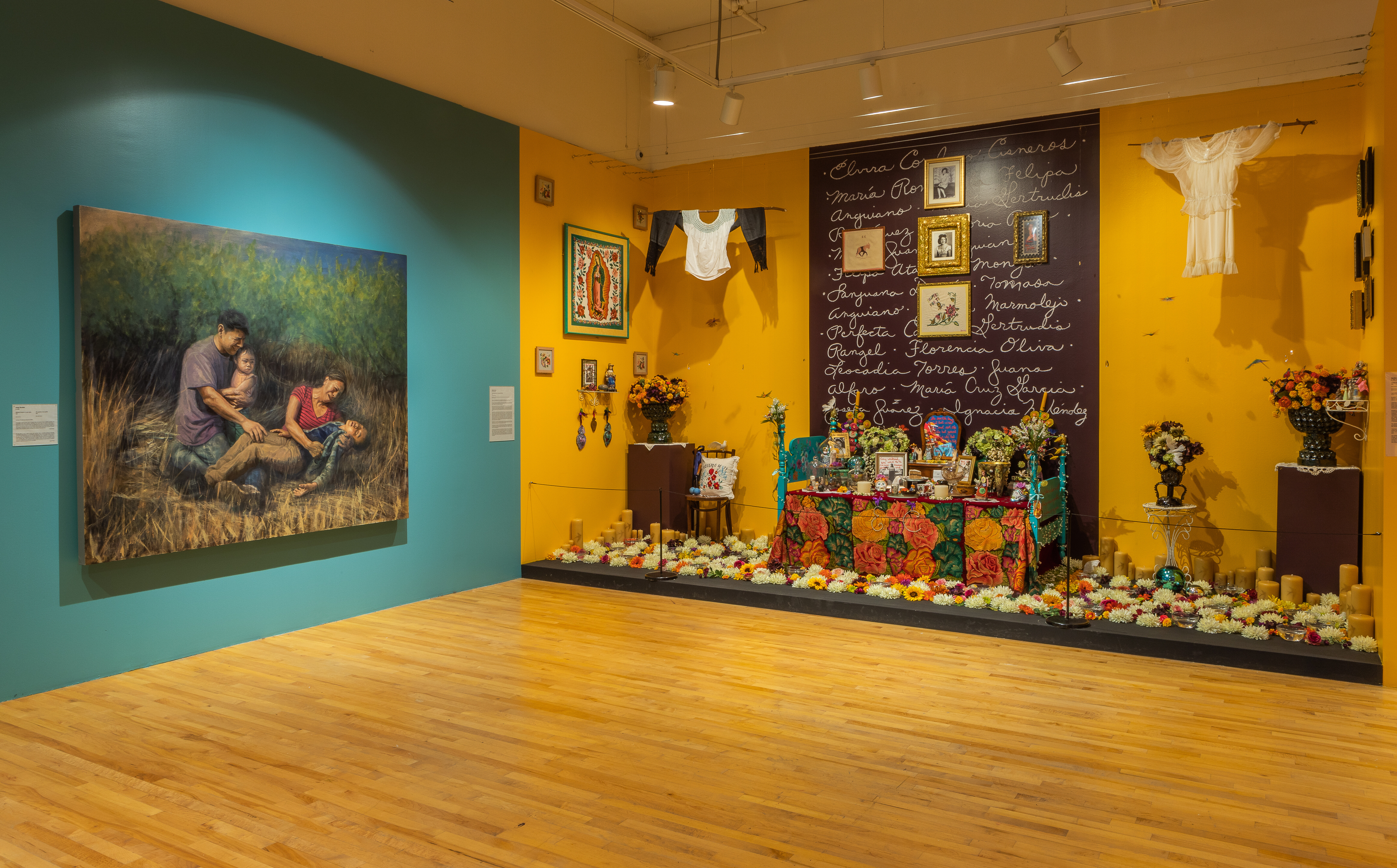 A painting by Arely Morales is next to the Ofrenda by Sandra Cisneros dedicated to her mother