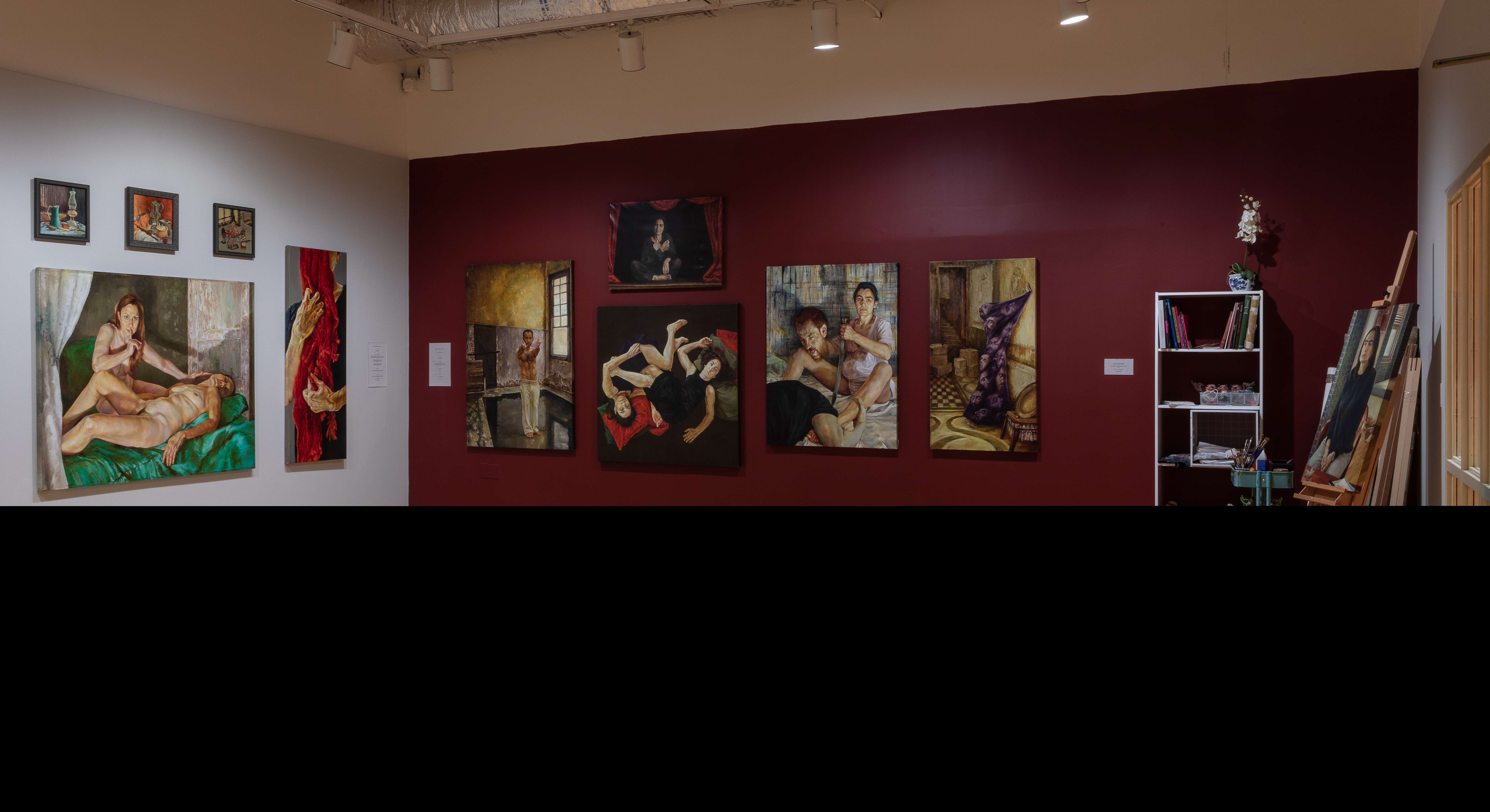 Gallery view of two wall displaying paintings.