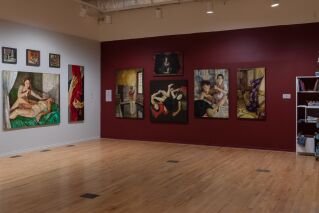 Gallery view of two wall displaying paintings.