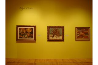 One gallery wall visible with three paintings