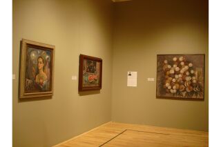 Two gallery walls visible. Two paintings on right wall and one painting on left wall with artist description