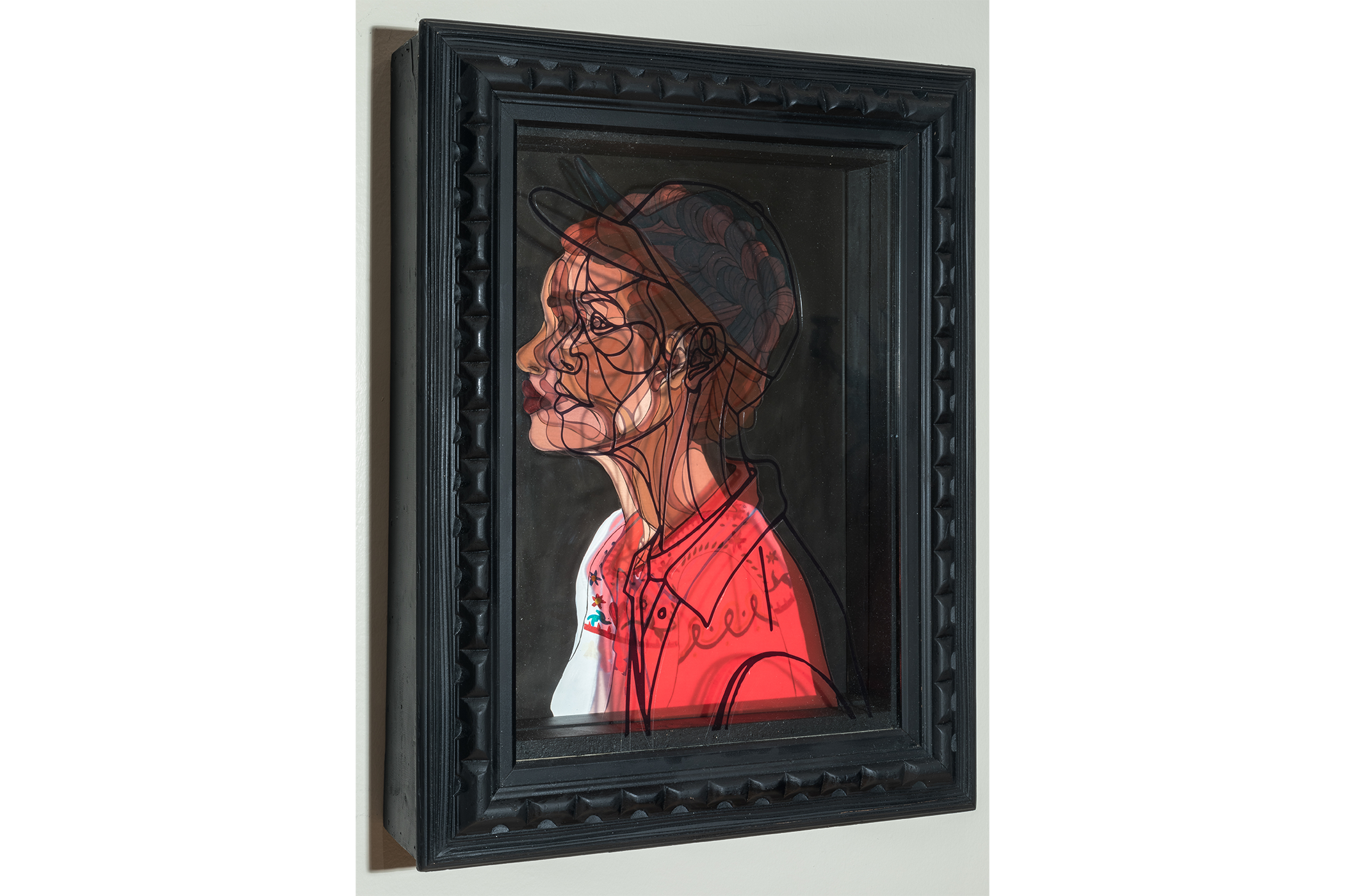 close up shot; a brown skin-toned woman ith an outline of a man panel overlay, referencing the transgender experience