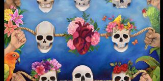 Three rows of skulls, the skulls hang on rope held by human hands at both ends. Blue sky background with floral lining the bottom.