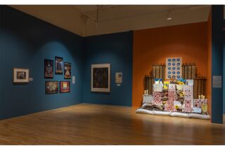 A gallery overview shot depicting the Ukrainian Memorial Altar and other artworks on display.