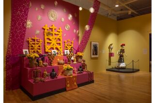 A Detail shot of the artworks on display in the yellow and pink room exhibit.