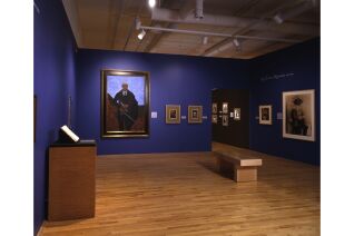 Ten paintings and photographs. Portrait painting by Tamayo and portrait photograph by Casasola are most noticeable and largest in this gallery photograph