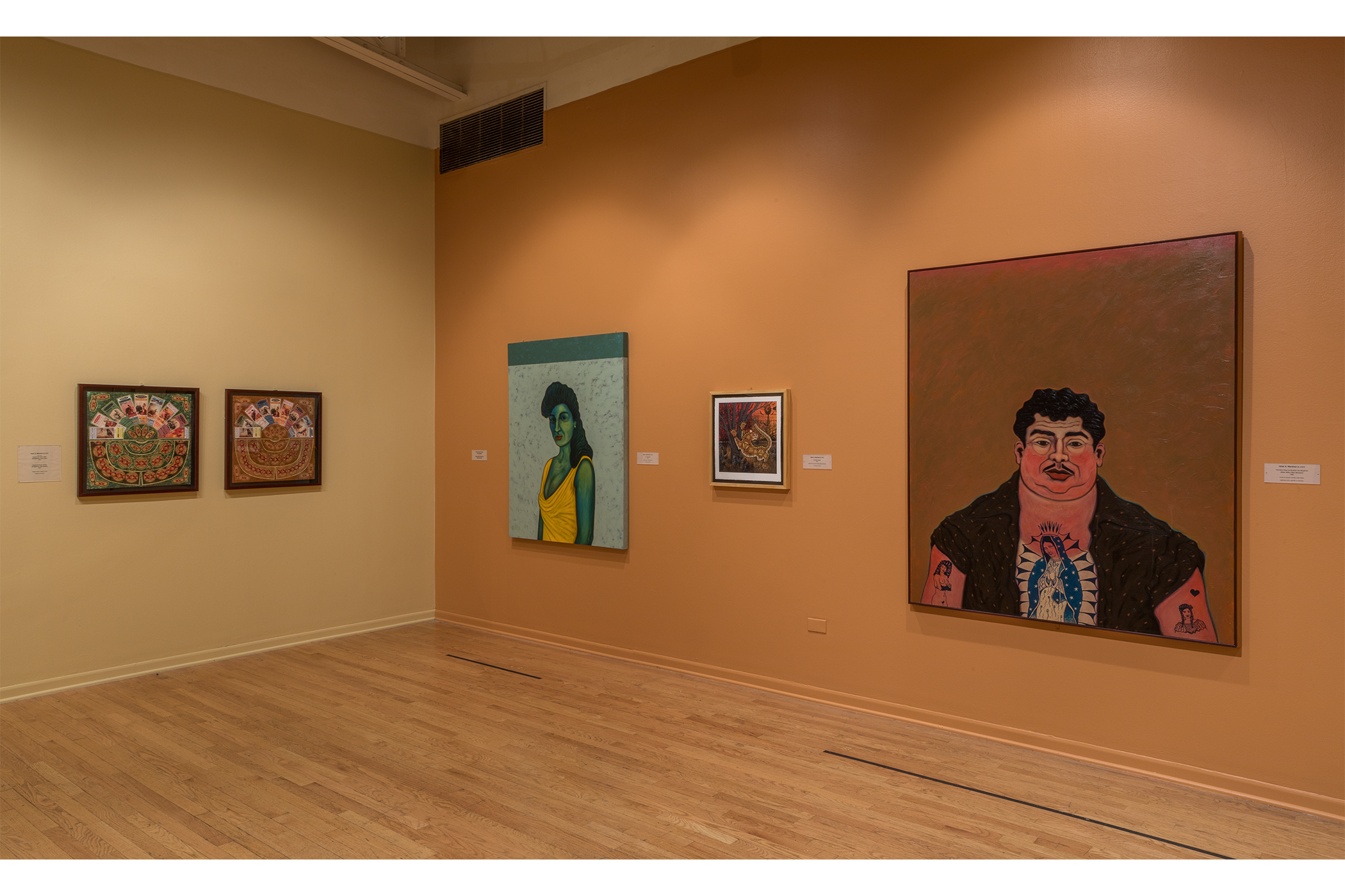 Left: two artworks hang on a beige wall. Right: three artworks hang on a terra cotta wall.