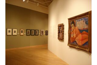 Image of two gallery walls with ten pieces of artwork and gallery description visible
