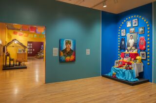 A painting of Vanessa Guillén is next to an ofrenda dedicated to Adam Toledo